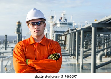 Young Engineer On The Deck Of Oil Tanker.