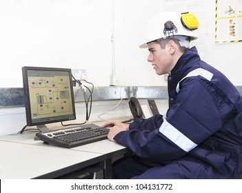 Young engineer working with computer in office. Indoor
