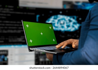 Young engineer works on binary code with copy space on laptop, reflecting the mindset of a tech world. Innovation hub with programming languages and development tools, coding life.