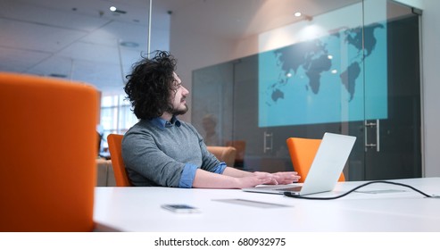 Young Entrepreneur Freelancer Working Using A Laptop In Coworking space - Shutterstock ID 680932975