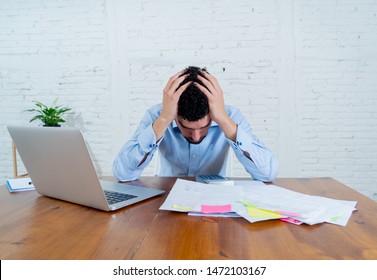 Young Entrepreneur Small Business Owner Paying Bills And Investment Expenses Having Money Problems. Furious And Desperate Man Feeling Stressed While Working Through Finances At Studio Home Office.