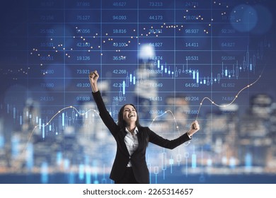 Young european businesswoman celebrating success on illuminated blurry night city background with forex chart. Triumph and lifestyle concept. Trade and financial market interest