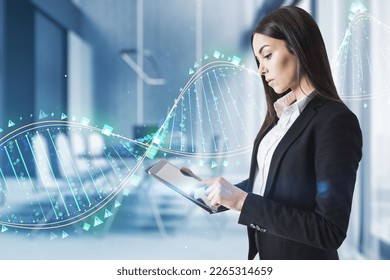 Young european businesswoman using digital tablet device with glowing binary code DNA helix on blurry office interior background. Human genome and innovative technologies concept. Double exposure