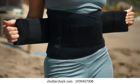 Young European Sports Girl Stands On The Beach In The Belt For Weight Loss With Sweat Withdrawal For Fitness Occupation