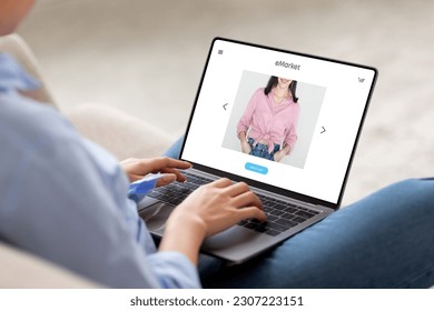 Young european woman sit on couch at home, using modern laptop for surfing in internet, enjoy online shopping, with fashion website store on screen, cropped. Shopaholic order clothes at home