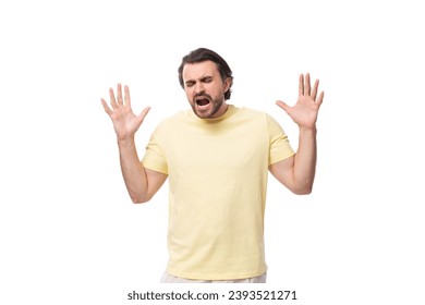 young excited man with black beard and mustache dressed in t-shirt - Shutterstock ID 2393521271