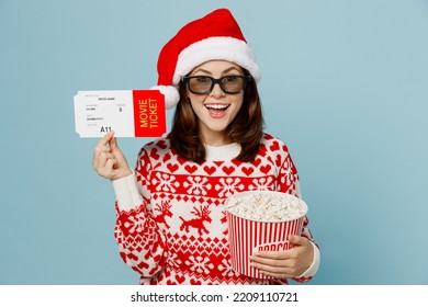 Young Excited Surprised Woman In 3d Glasses Watch Movie Film Hold Bucket Of Popcorn In Cinema Ticket Isolated On Plain Pastel Blue Cyan Background Studio Portrait Happy New Year 2023 Holiday Concept