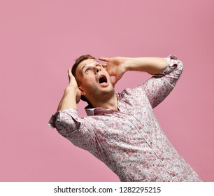 Young Exited Man Scary Surprised In Shirt Lucky Winner Shouting Looking Up On Pink Background