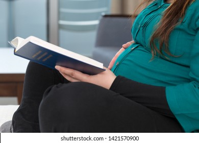 Young Expectant Mom Reading Her Bible In The Morning