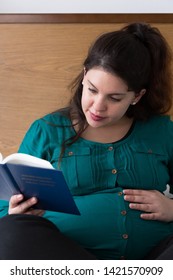 Young Expectant Mom Reading Her Bible In The Morning