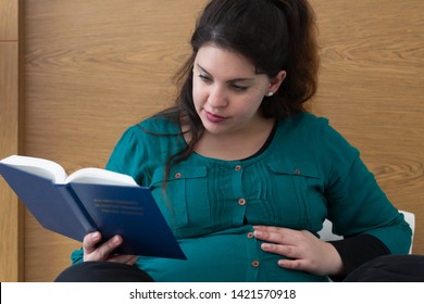 Young Expectant Mom Reading Her Bible In The Morning