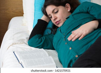 Young Expectant Mom Reading Her Bible In The Morning