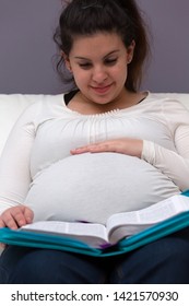 Young Expectant Mom Reading Her Bible In The Morning