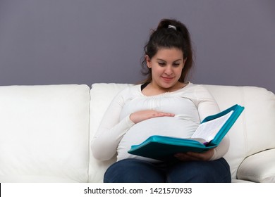 Young Expectant Mom Reading Her Bible In The Morning