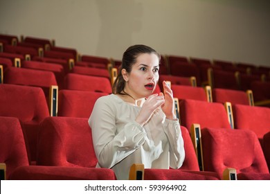 Young Expressive Woman Watching Theatre Show, Emotion Fright, Cinema Concept
