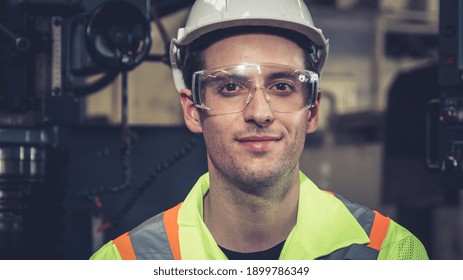 Young Factory Worker Or Engineer Close Up Portrait In Factory . Industry And Engineering Concept .