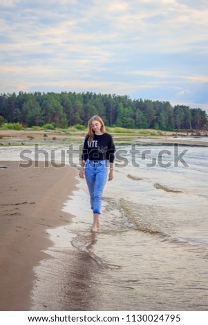 Similar – Young woman on the beach in the sun