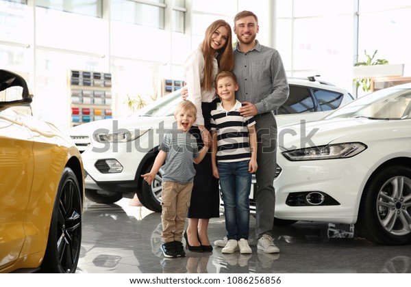 Young family in car\
salon