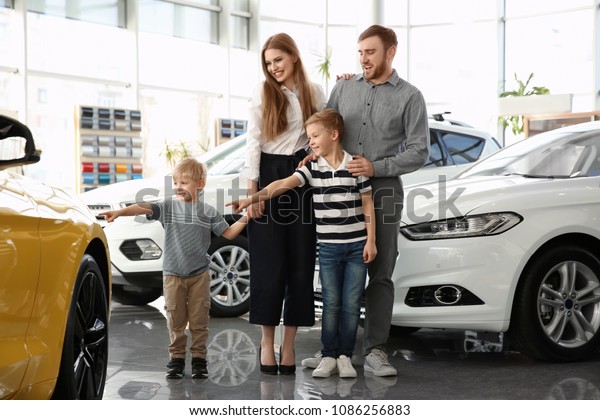 Young family in car\
salon