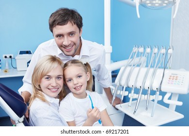 Young Family With A Child In Dentistry