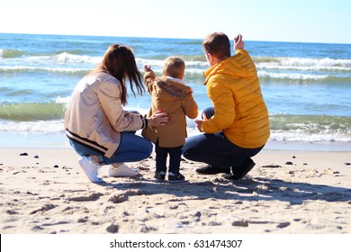  Young Family With A Child On The Shores Of The Baltic Sea