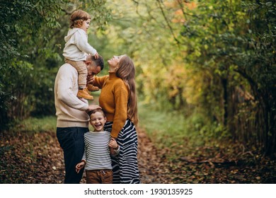 Young Family With Children In Autumn Park