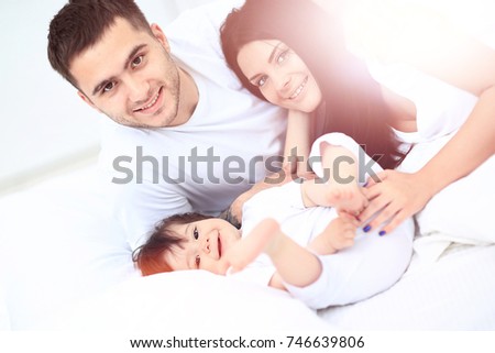 A young family with young children to bed in the bedroom