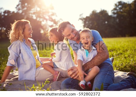 Young family with children having fun in nature 