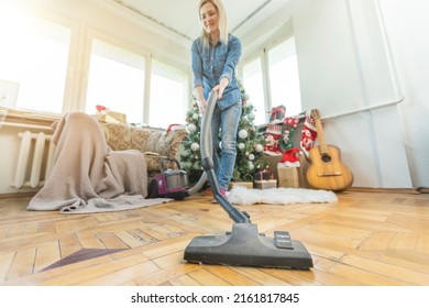 Young Family Cleaning Apartment After Christmas Party.