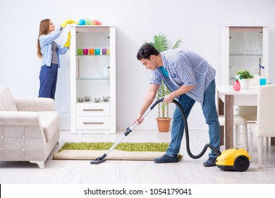 Young Family Cleaning The House