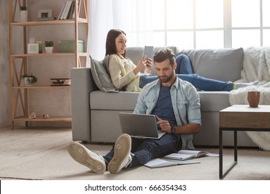 Young Family Couple Together At Home Casual