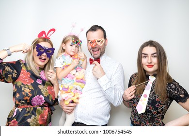 Young Family Dad Mom Daughter Baby Sitter Pose Photo Booth Studio Portrait Props Happy Party Wedding