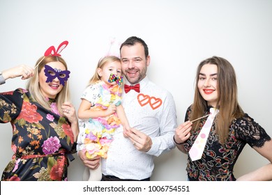 Young Family Dad Mom Daughter Baby Sitter Pose Photo Booth Studio Portrait Props Happy Party Wedding