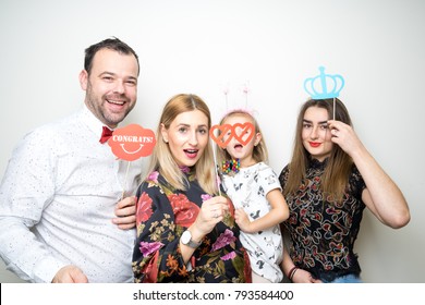 Young Family Dad Mom Daughter Pose Photo Booth Funny Party Props Plain White Background