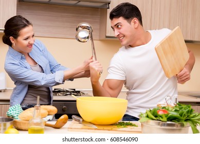 Young Family Doing Funny Fight At Kitchen