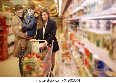 Young Family In A Grocery Store