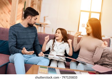 Young family with little girl sitting on sofa with upholstery samples. They together came to Mom Teaches Little Daughter Do Makeup Stock Photo (Edit Now ...