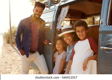 Young Family Make A Stop On A Road Trip In Their Camper Van