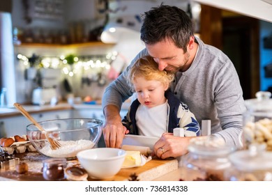 Young family making cookies at home. - Powered by Shutterstock