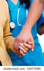 Young Family Member Taking An Elderly Woman For Special Care - Medical Attention Concept.