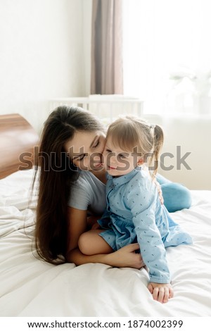 Similar – mother and child son sleeping together in bed