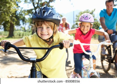 Young Family On Country Bike Ride