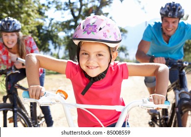 Young Family On Country Bike Ride