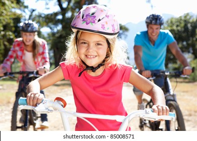 Young Family On Country Bike Ride