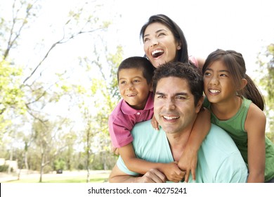 Young Family In Park