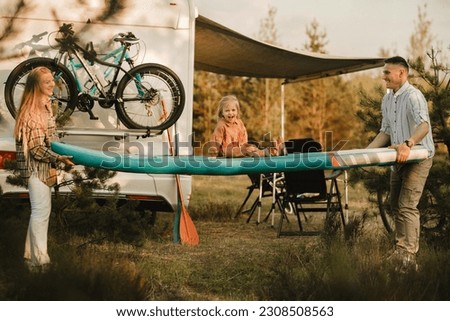 Similar – Image, Stock Photo Woman walking up ladder to tent over car