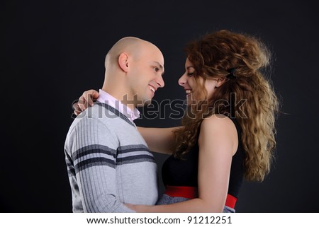 Similar – Image, Stock Photo Studio portrait of a young couple hugging