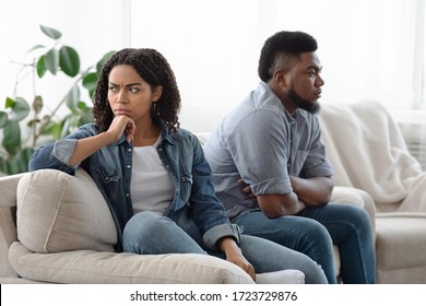 Young Family Problems. Pensive Man And Woman Sitting Upset After Quarrel At Home, Ignoring Each Other