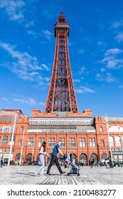 A Young Family Seen Walking Passed Blackpool Tower On The Comedy Carpet In September 2021.