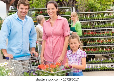 Young Family Shopping At Garden Centre Flower Market